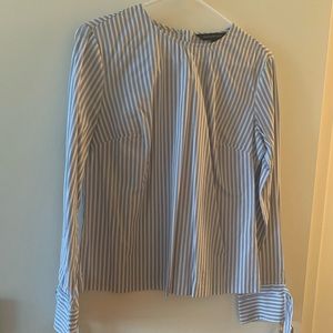 Pinstripe shirt with bow tie sleeve